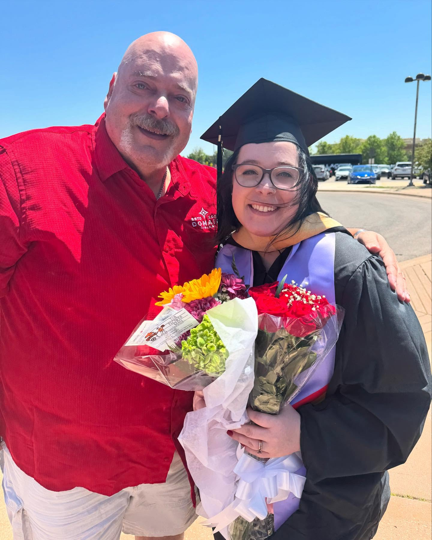 Joseph with his second daughter at her graduation as a licensed social worker and mental health counselor